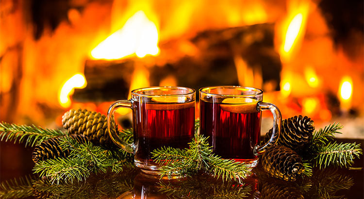 holiday drinks in front of a fire