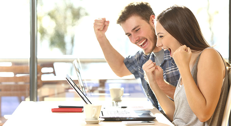 couple in front of laptop