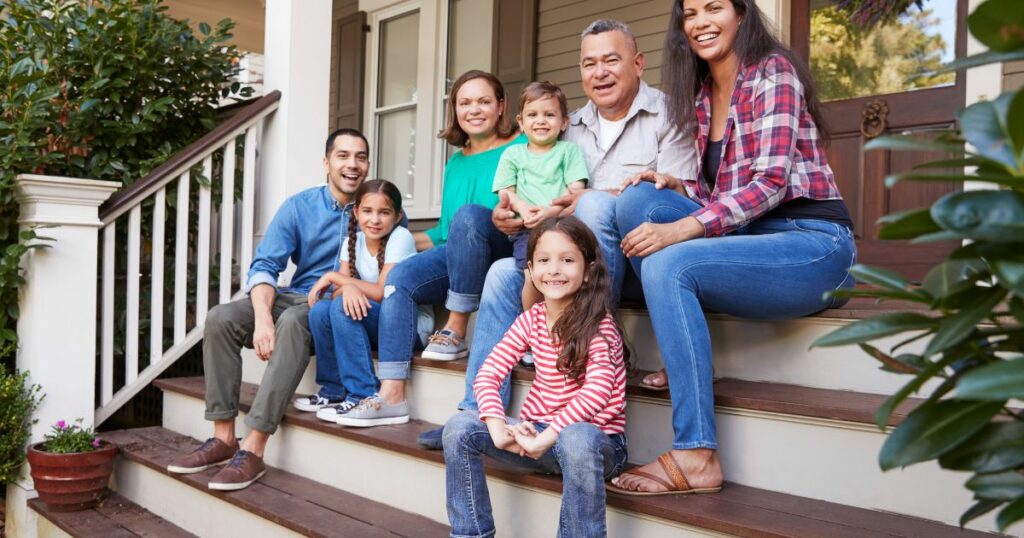 multigenerational family sitting on porch